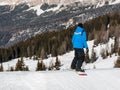 Freestyle snowboarder with helmet in snowpark