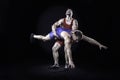 Freestyle wrestler throwing action isolated on black background Royalty Free Stock Photo