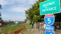 Freeway entrance, information sign on crossraod in USA. Route to Los Angeles, California. Interstate highway 5 signpost as symbol