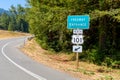 Freeway entrance sign in a pine forest