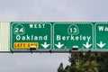 Freeway signage providing information about the lanes going to Oakland and Berkeley; San Francisco bay area, California Royalty Free Stock Photo