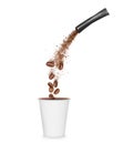 Freeze dried instant coffee pours from the packaging in a mug. Conceptual image on a white background