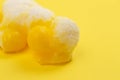 Freeze Dried Lemon Flavored Candy on a Bright Yellow Background Royalty Free Stock Photo