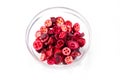 Freeze-dried organic cranberry berries in glass bowl, natural food concept