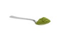 Freeze dried young organic wheatgrass powder teaspoon isolated on white Royalty Free Stock Photo