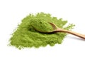 Freeze dried young wheatgrass powder in wooden spoon isolated on white Royalty Free Stock Photo