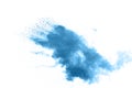 Freeze motion of blue dust explosion on white background. Throwing blue powder out of hand against dark background Royalty Free Stock Photo