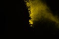 Freeze motion of color powder exploding on black background. Col Royalty Free Stock Photo