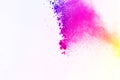 Freeze motion of color powder exploding on white background. Col Royalty Free Stock Photo