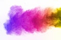 Freeze motion of colored dust explosion isolated. Colorful powder explosion on white background. Royalty Free Stock Photo