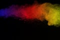 Freeze motion of colored powder explosion isolated on black background. Abstract of colorful dust splatted. Royalty Free Stock Photo