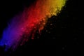 Freeze motion of colored powder explosion isolated on black background. Abstract of colorful dust splatted. Royalty Free Stock Photo