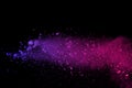 Freeze motion of colored powder explosion isolated on black background. Abstract of Multicolor dust splatted. Royalty Free Stock Photo