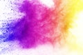 Freeze motion of colored powder explosion isolated on black background. Abstract of Multicolor dust splatted. Royalty Free Stock Photo