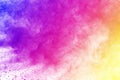 Freeze motion of colored powder explosion isolated on black background. Abstract of Multicolor dust splatted. Royalty Free Stock Photo