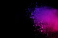 Freeze motion of colored powder explosion isolated on black background. Abstract of Multicolor dust splatted. Royalty Free Stock Photo