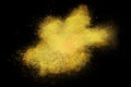 Freeze motion of colorful yellow powder exploding