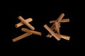 Freeze motion of flying group of Cinnamon Sticks . Isolated on black background. Royalty Free Stock Photo