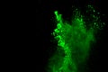 Freeze motion of green powder exploding/throwing green dust Royalty Free Stock Photo