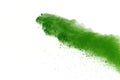 Freeze motion of Green powder exploding on white background. Royalty Free Stock Photo