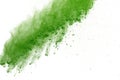 Freeze motion of Green powder exploding on white background. Royalty Free Stock Photo