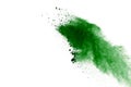 Freeze motion of green powder exploding on white background Royalty Free Stock Photo