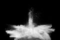 Freeze motion of white dust particles splash on black background.White powder explosion clouds Royalty Free Stock Photo