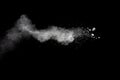 Freeze motion of white dust particles splash on black background.White powder explosion clouds Royalty Free Stock Photo