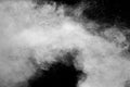 Freeze motion of white dust particles splash on black background.White powder explosion clouds Royalty Free Stock Photo