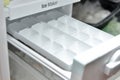 Freezer tray for freezing ice cubes in the freezer. Ice maker for refrigerators, household Royalty Free Stock Photo