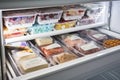 freezer with variety of frozen foods and snacks, including individually wrapped ice pops