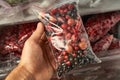 Freezing berries for the winter. Packaged frozen berries in plastic bags. In the freezer