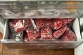 Freezing berries for the winter. Packaged frozen berries in plastic bags. In the freezer