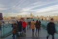 Crowds on Millennium Bridge, with St Pauls in the background. London