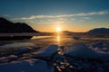 freezing fiord at sunrise, with the sun emerging over the horizon