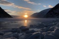 freezing fiord at sunrise, with the sun emerging over the horizon