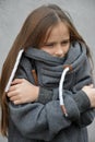 Freezing girl snuggles in her woolen sweater Royalty Free Stock Photo