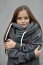 Freezing girl snuggles in her woolen sweater Royalty Free Stock Photo