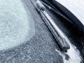 Freezing rain. Close-up details of a frozen parked car in the morning of a winter day.