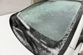 Freezing Rain Creates a Layer of Ice and Coats a Passenger Vehicle. Close up of Windshield Royalty Free Stock Photo