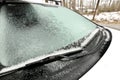 Freezing Rain Creates a Layer of Ice and Coats a Passenger Vehicle. Close up of Windshield Royalty Free Stock Photo