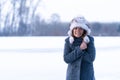 young freezing woman on winter icy lake