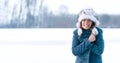 young freezing woman on winter icy lake. Banner. Copy space