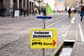 Freiburg, Germany - Sign pointing to shop that sells small wooden toy boats children can float on stream