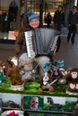 Freiburg im Breisgau, Germany - 11 09 2012: An old man with funny plush toys plays the accordion on the street