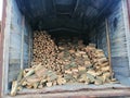 Freight car with firewood. A pile of firewood for kindling the boiler.