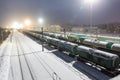 Freight cars on the sorting cargo station in the light of searchlights