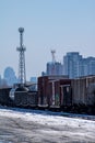 Freight Cars With Tall Condos In The Background