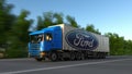 Freight semi truck with Ford Motor Company logo driving along forest road. Editorial 3D rendering