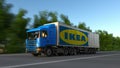 Freight semi truck with Ikea logo driving along forest road. Editorial 3D rendering